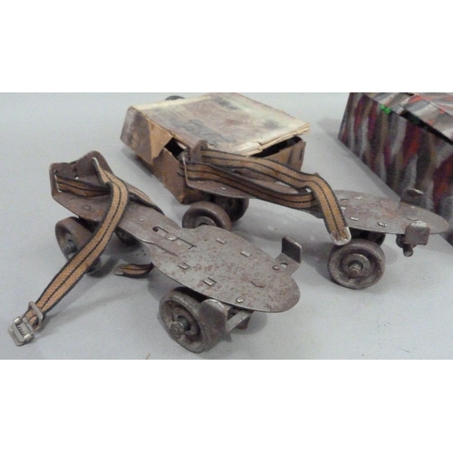 234 - Vintage Christmas decorations including crackers together with a pair of roller skates and a pair of... 