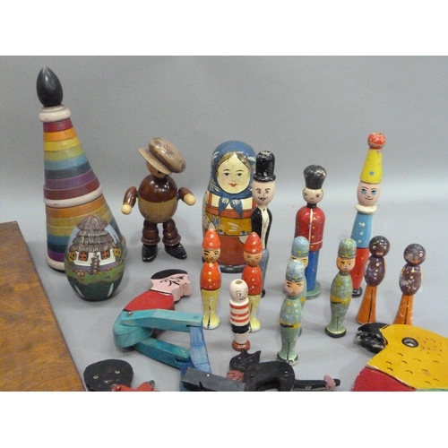 235 - A bar skittles game together with a collection of painted wooden toys including a balancing parrot, ... 