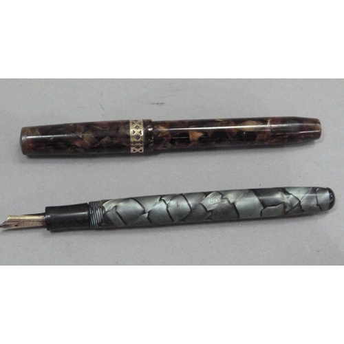 239 - A Swan Visofil fountain pen by Mabie Todd & Co Ltd, 14ct gold nib, brown marbled case with yellow me... 