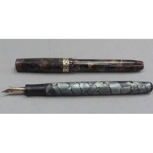 239 - A Swan Visofil fountain pen by Mabie Todd & Co Ltd, 14ct gold nib, brown marbled case with yellow me... 