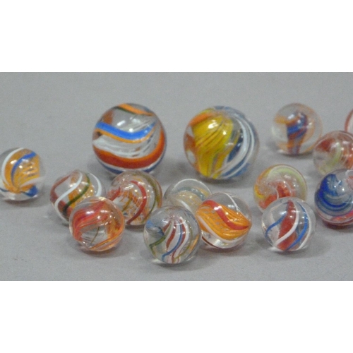 242 - A collection of vintage marbles to include six 'agate' marbles, six two-colour marbles with orange l... 