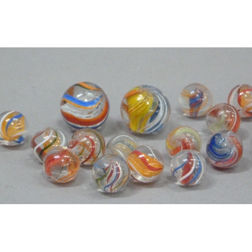 242 - A collection of vintage marbles to include six 'agate' marbles, six two-colour marbles with orange l... 