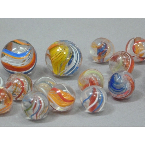 242 - A collection of vintage marbles to include six 'agate' marbles, six two-colour marbles with orange l... 