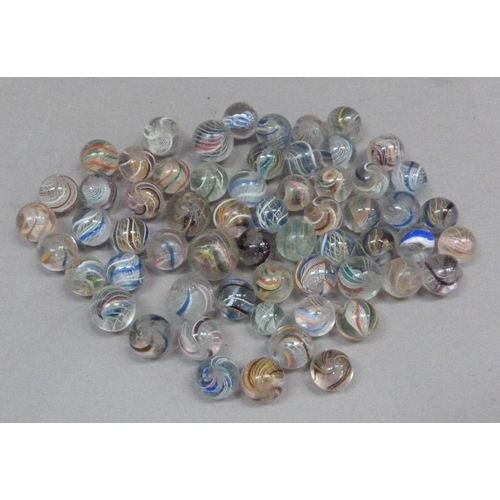 243 - A collection of vintage marbles to include multi-coloured swirls with white and coloured latticino a... 