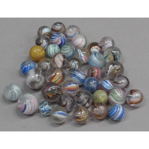 243 - A collection of vintage marbles to include multi-coloured swirls with white and coloured latticino a... 