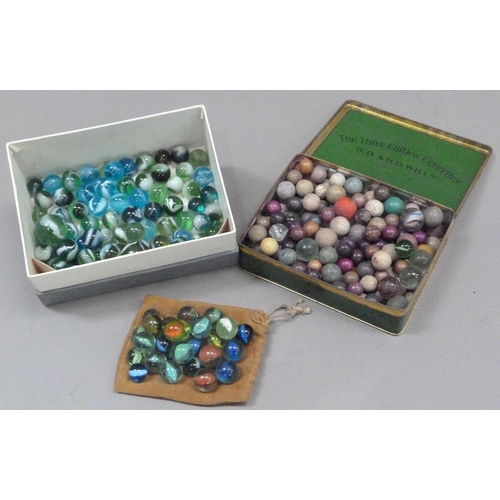 244 - A collection of vintage marbles to include shades of green to blue with a white swirl (approximately... 