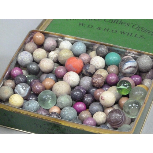 244 - A collection of vintage marbles to include shades of green to blue with a white swirl (approximately... 