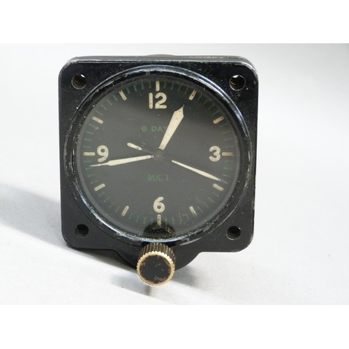 294 - A WWII aviation 8-day clock model 43A-4 manufactured by Jaeger Watch Co Inc USA with black metal cas... 