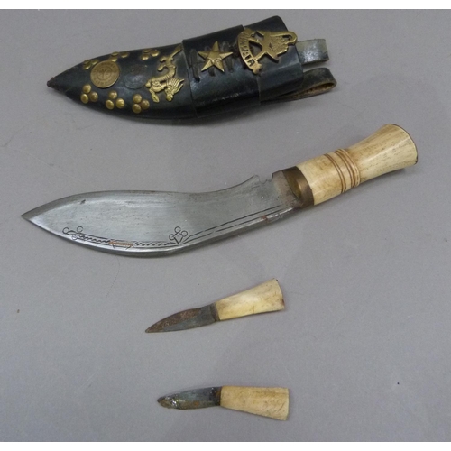 296 - A Nepalese knife with short curved blade, 16.5cm, bone handle, with two small bone handle knives in ... 