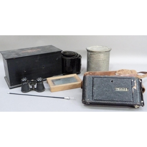 304 - A vintage Kodak film tank, a Kodak wooden film tank, a box of assorted black paper masks and discs p... 