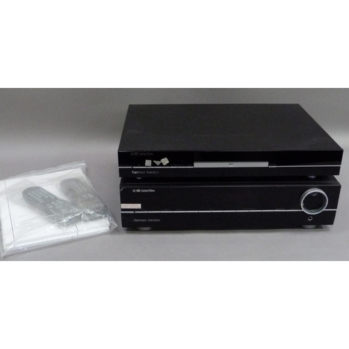 311 - A Harman/Kardon HD970 Ltd Ed CD player and a HK970 integrated amplifier together with two remote con... 