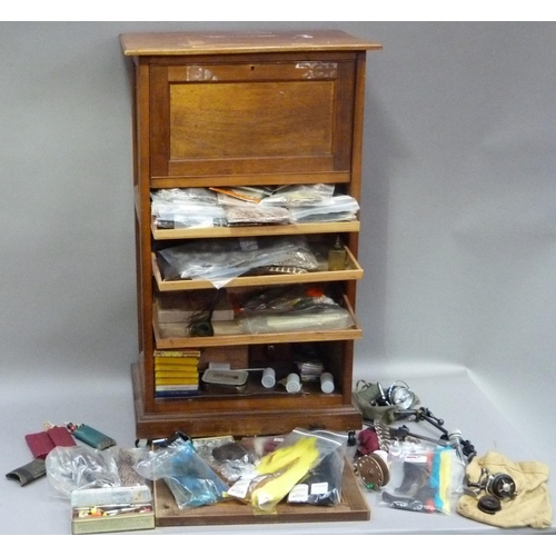 317 - A cabinet of fly tying materials 1950s and later including, tools, colour threads, large selection o... 