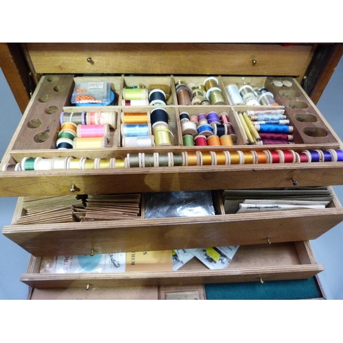 317 - A cabinet of fly tying materials 1950s and later including, tools, colour threads, large selection o... 