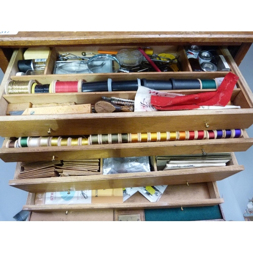 317 - A cabinet of fly tying materials 1950s and later including, tools, colour threads, large selection o... 