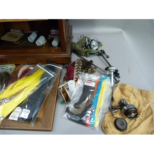 317 - A cabinet of fly tying materials 1950s and later including, tools, colour threads, large selection o... 