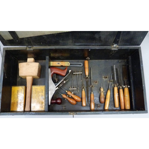 321 - A vintage GTL wooden tool chest, containing a good array of wood working and household tools to incl... 