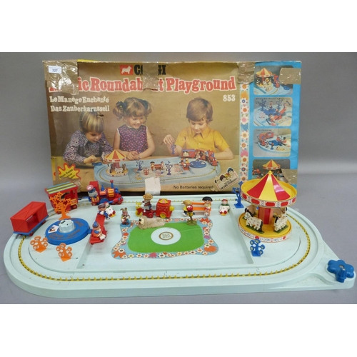 327 - A Corgi Magic Roundabout playground, in original box (tatty)