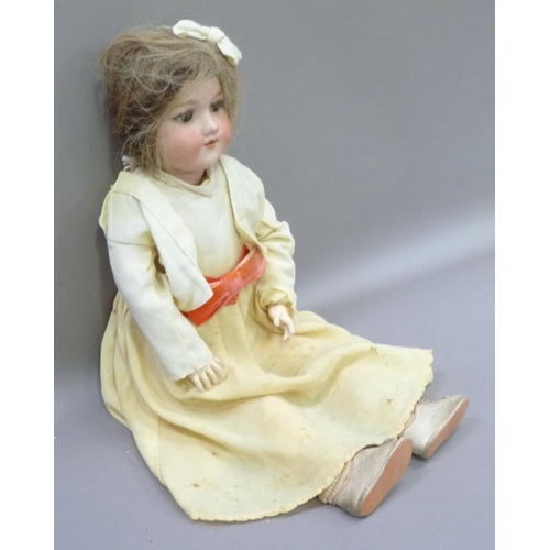 329 - An Armand Marseille bisque headed doll having brown sleeping eyes; open mouth with four teeth, paint... 