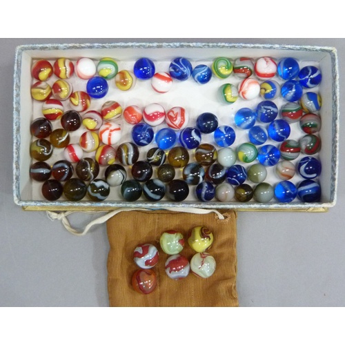 245 - A quantity of vintage marbles to include, red and white opaque, tri-colour swirls, blue with white s... 