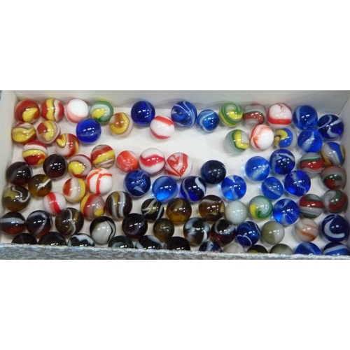 245 - A quantity of vintage marbles to include, red and white opaque, tri-colour swirls, blue with white s... 