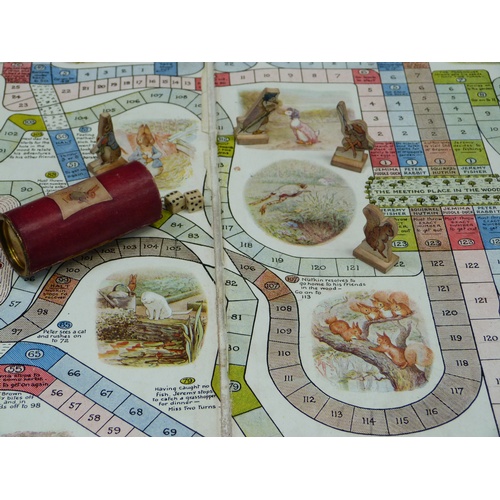 256 - Peter Rabbit's Race Game, to include board, four boxed figures with dice and a shaker, together with... 