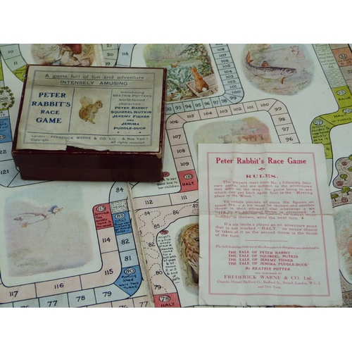 256 - Peter Rabbit's Race Game, to include board, four boxed figures with dice and a shaker, together with... 