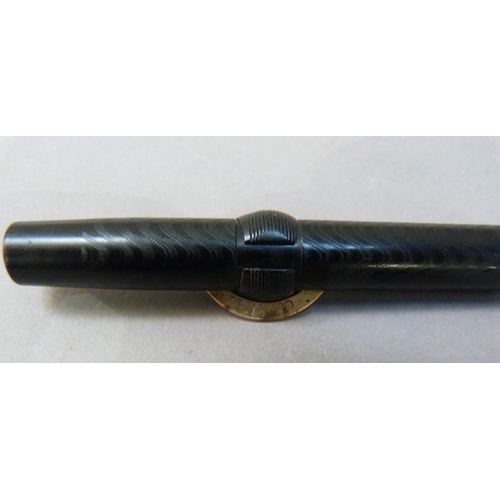 36 - A vintage Conklin crescent filler fountain pen in a black case with wavy decoration 14k nib the yell... 