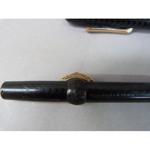 36 - A vintage Conklin crescent filler fountain pen in a black case with wavy decoration 14k nib the yell... 