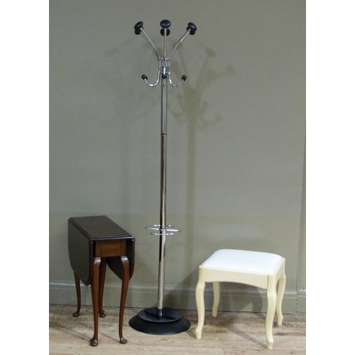 121 - A mahogany drop leaf table, a chromium plated and black plastic hat and coat stand and a dressing ta... 
