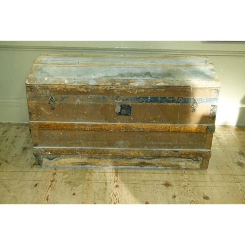 127 - A metal and wooden bound fabric covered trunk, 92cm wide