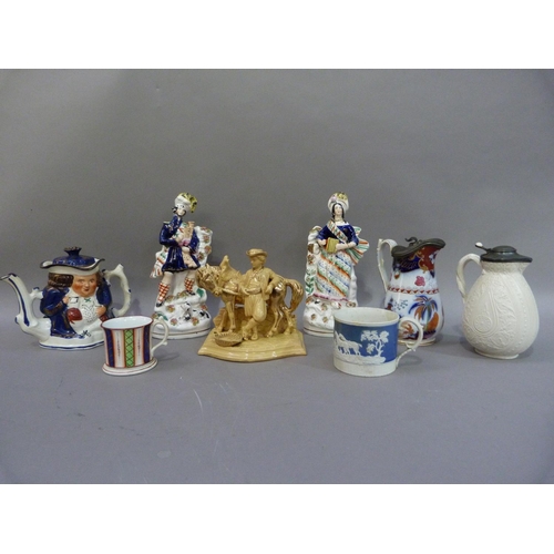 157 - A pair of Victorian Scottish flatback figure groups, together with two Victorian jugs, two mugs, tea... 
