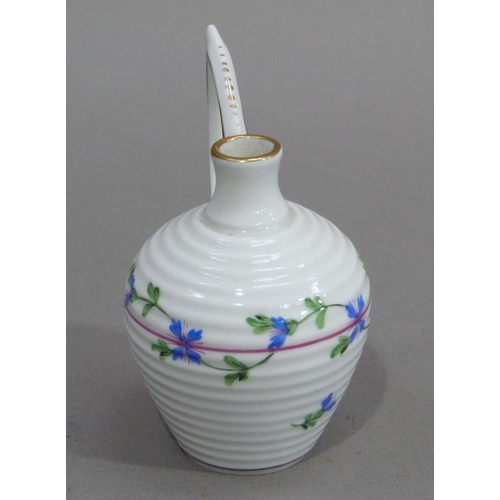 4 - A Herend miniature jug of ribbed form with high angular handle, painted with trailing blue flowers, ... 