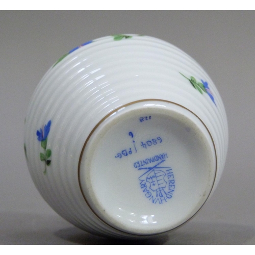 4 - A Herend miniature jug of ribbed form with high angular handle, painted with trailing blue flowers, ... 