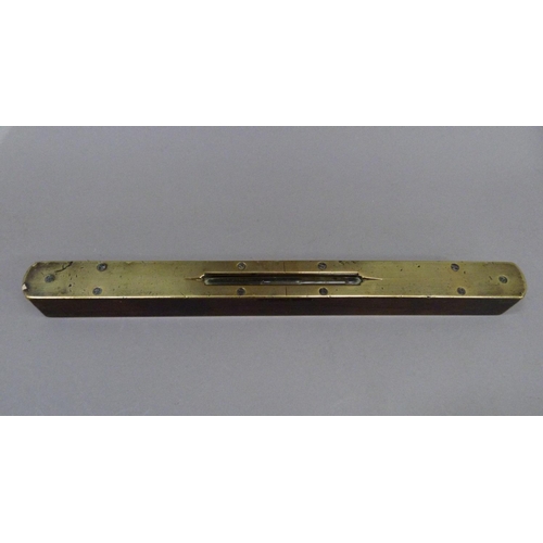 55 - A Victorian brass mounted rosewood level of rounded rectangular form, 30cm long