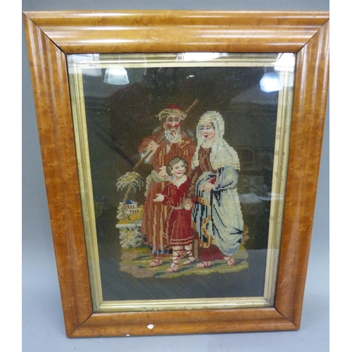 391 - A Victorian needlework picture of couple and child in landscape worked in gros and petite pois, gilt... 