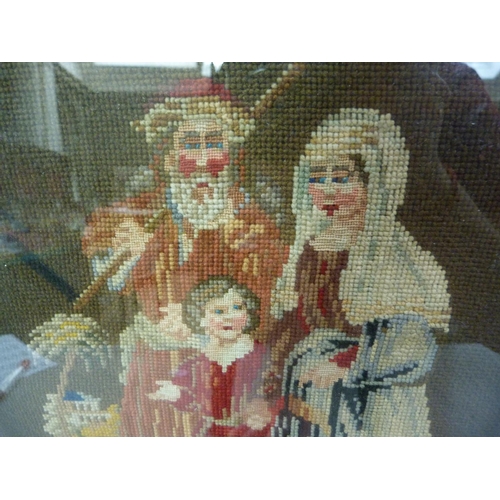 391 - A Victorian needlework picture of couple and child in landscape worked in gros and petite pois, gilt... 