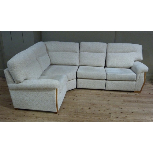 411 - A large modern upholstered L shaped sofa upholstered in cream chenille by High Seat Ltd