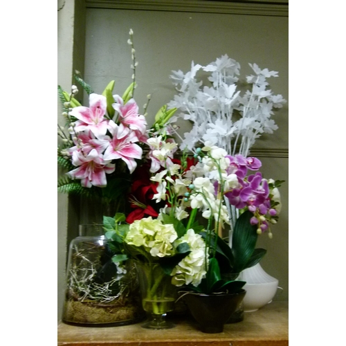 126 - A quantity of fake plants, flowers etc with battery powered LED lights