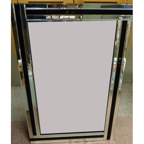 138 - A bevelled wall mirror with black glass and bevelled mirror border, 90cm x 60cm