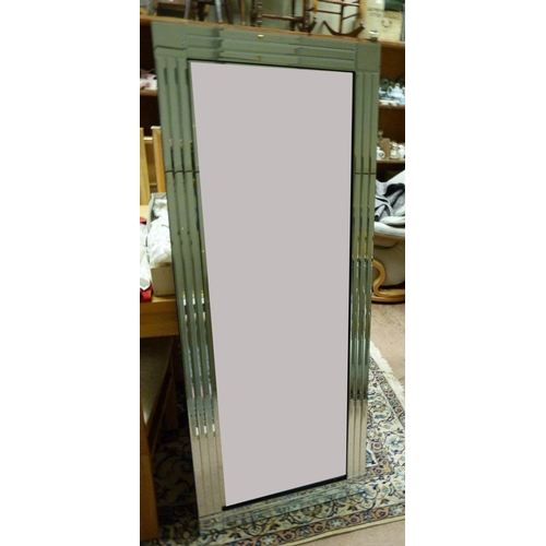 139 - A Bevelled wall mirror with triple bevelled mirrored border with square corners, 150cm x 60cm