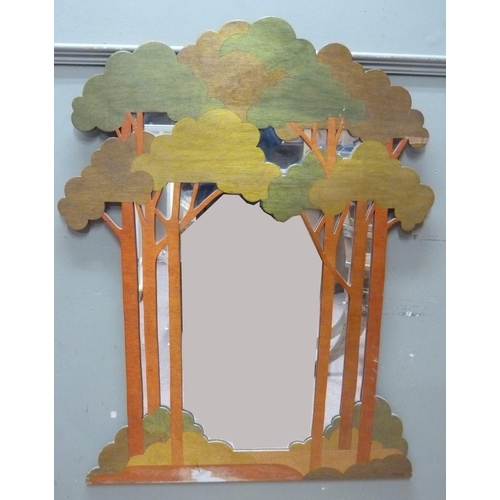 140 - A modern decorative mirror, the fret carved frame modelled as an open glade, the trees stained green... 