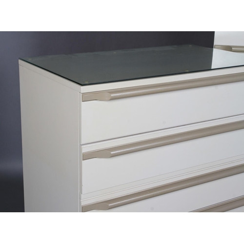 142 - Uniflex International Furniture, a two tone cream two door wardrobe and five drawer chest with bar h... 