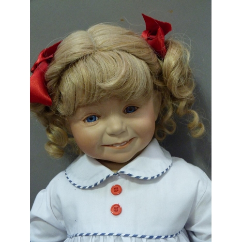 148 - A collection of modern porcelain headed dolls including Marie Antoinette and Princess Grace of Monac... 