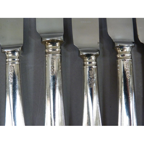 301 - A set of twelve Harrods silver handled dessert knives and eleven matching dinner knives, Sheffield 1... 