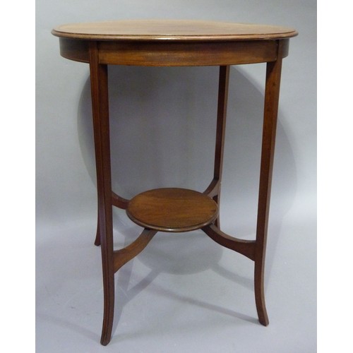 400 - An Edwardian mahogany circular two tier occasional table on splayed square tapered legs with underti... 