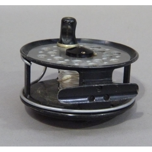 153 - A JW Young and Sons limited Beaudex fly reel with black japanned pierced aluminum spool and foot wit... 