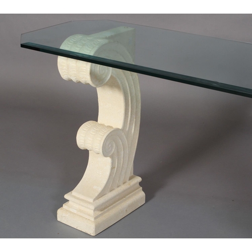 23 - A bevelled glass console table on cast stone-effect twin scroll base rectangular with cut corners, 1... 