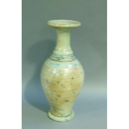 39 - A baluster vase with everted rim, the raku glaze tinted from duck egg blue to turquoise. on circular... 