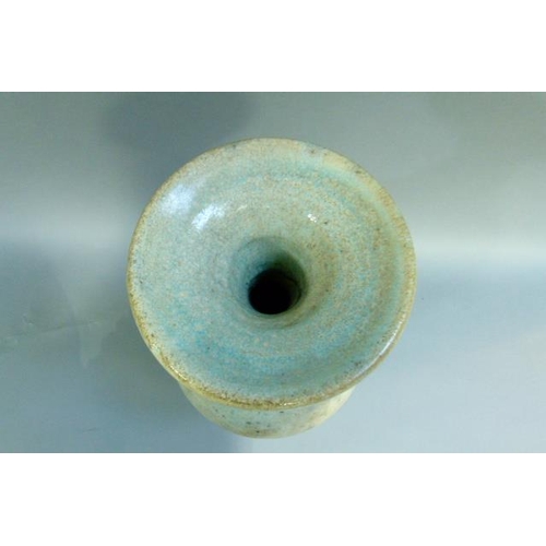 39 - A baluster vase with everted rim, the raku glaze tinted from duck egg blue to turquoise. on circular... 