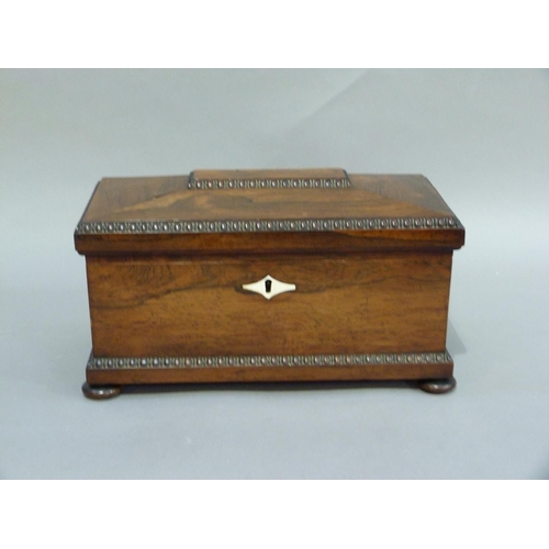 77 - A William IV rosewood veneered sarcophagus shaped tea caddy with bead and reel borders throughout, t... 